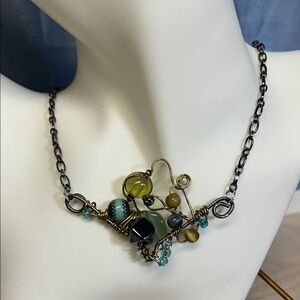Elegant Wire Wrapped Necklace with Green and Gold Details
